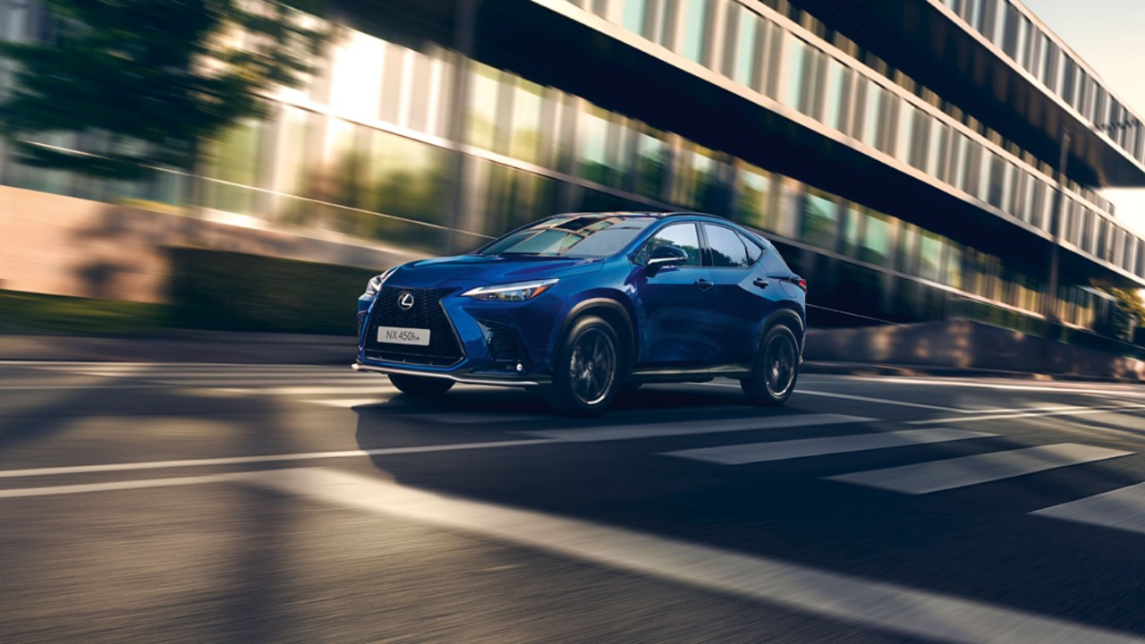 A Lexus NX 450h+ driving